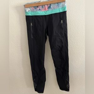 Lululemon black leggings size 4 with 23” inseam and zipper pockets